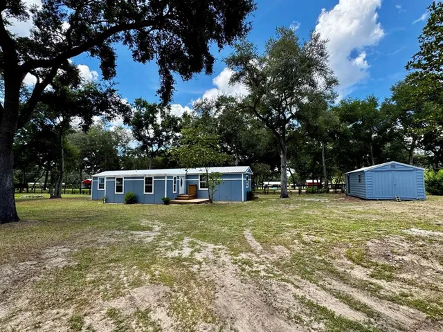 a house with trees in the background