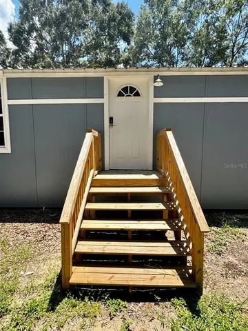 a view of a door and a mirror