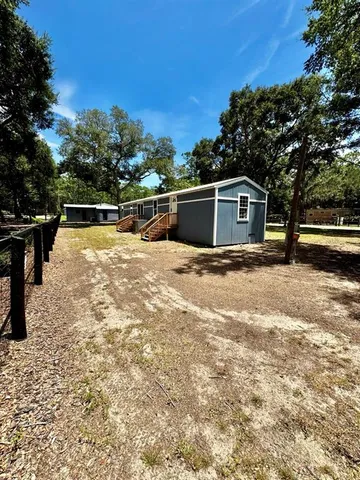 a house with a tree in the background