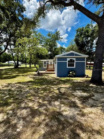 a view of a house with swimming pool