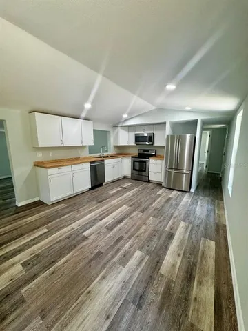 a room with a bed and cabinets