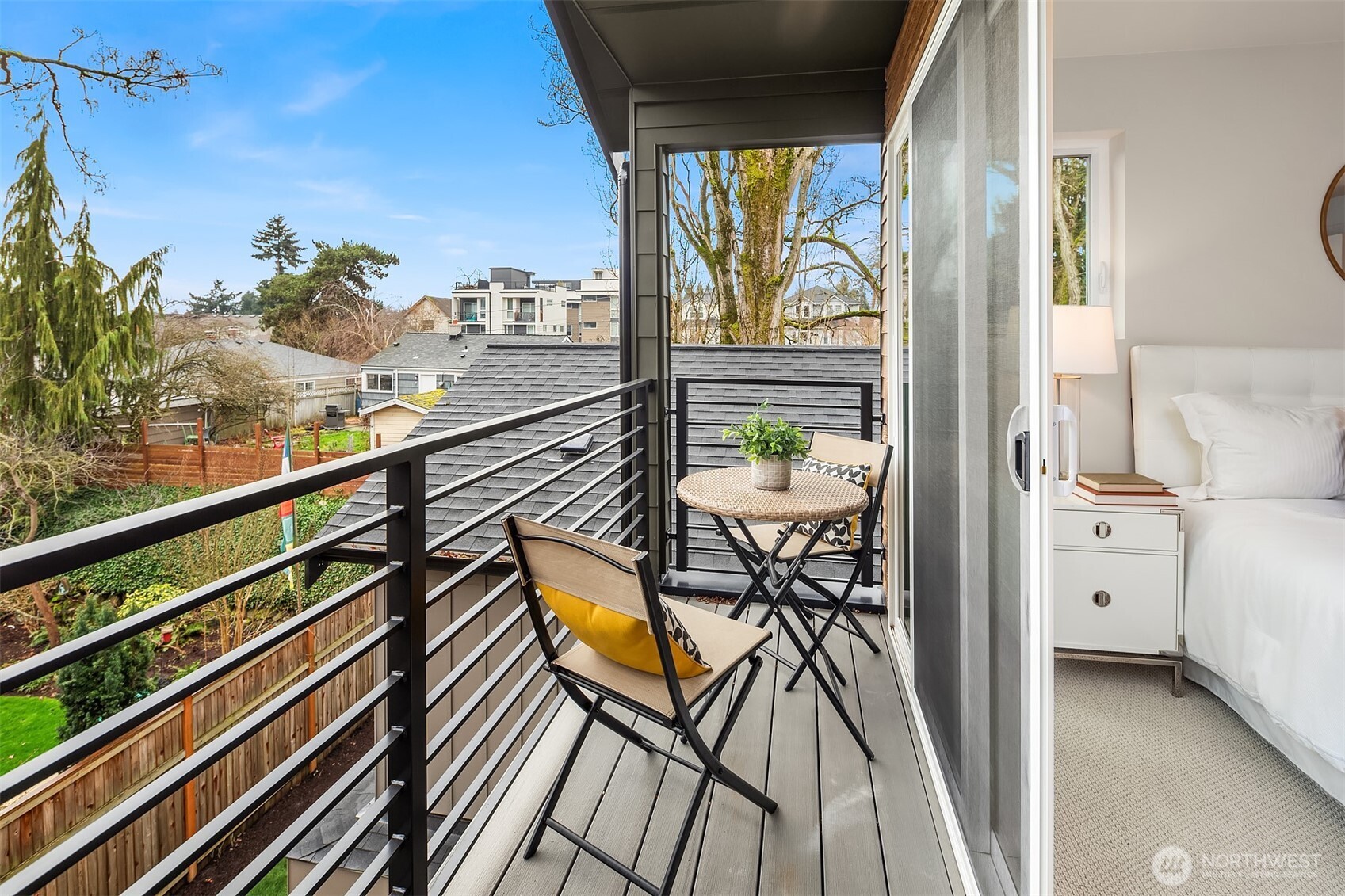 8823 Ashworth Avenue North, Unit B Seattle, WA 98103 - Photo 13 of 15 a view of a balcony with furniture and a potted plant