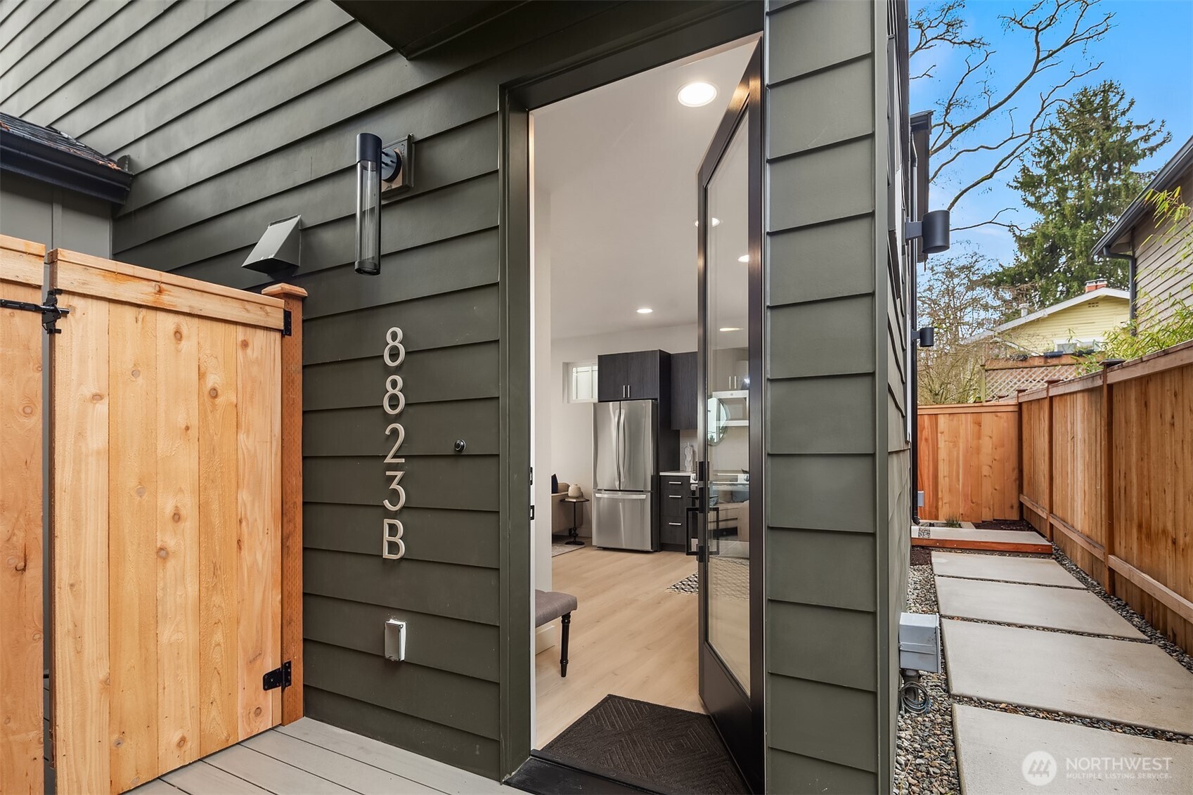 8823 Ashworth Avenue North, Unit B Seattle, WA 98103 - Photo 2 of 15 a view of walk in closet with clothes and shoes