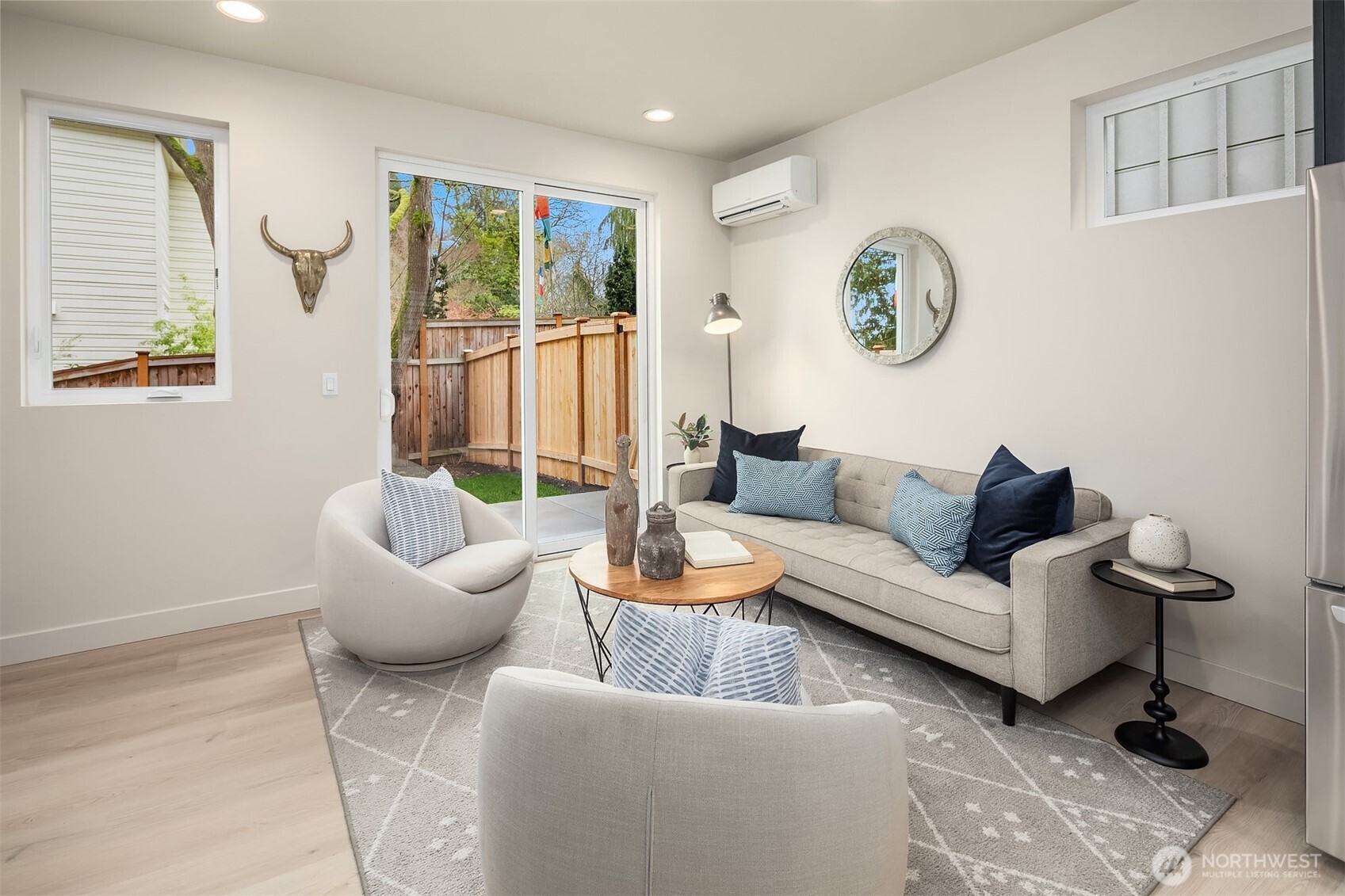 8823 Ashworth Avenue North, Unit B Seattle, WA 98103 - Photo 5 of 15 a living room with furniture and a large window