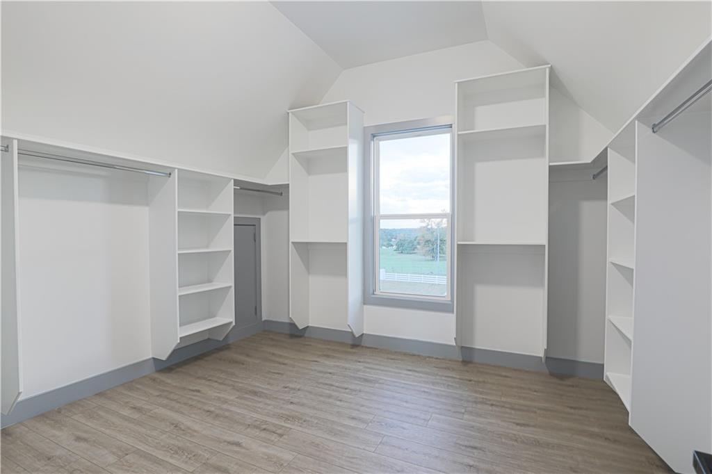 1341 Wheeler Creek Road Maysville, GA 30558 - Photo 48 of 51 a view of an empty room with a window and wooden floor