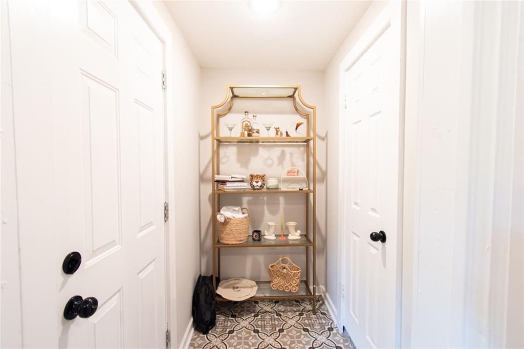 702 Radford Street Monroe, GA 30655 - Photo 22 of 49 a bathroom with a toilet and a shower curtain