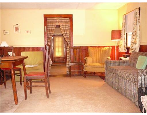 18W Budlong Farm Road Warwick, RI 02886 - Photo 4 of 12 Living Room. The cozy living room has paned doors and is open to the dining area. Original wainscoting adds a classic touch of the 1930s. Settle in after a day of clamming. The bay provides at least one supper per week!