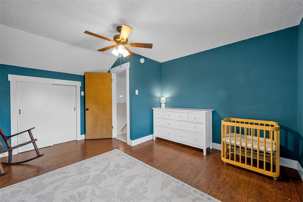 3000 North 15th A Street Waco, TX 76708 - Photo 17 of 24 a living room with furniture and a baby crib