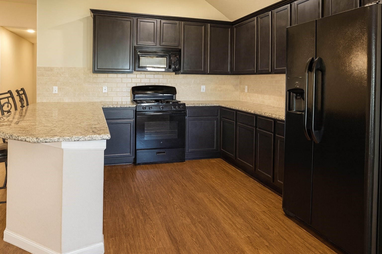 54 Rodeo Crest Drive Manvel, TX 77578 - Photo 3 of 10 a kitchen with a refrigerator stove and microwave