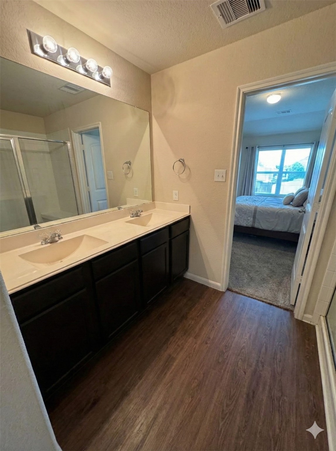 54 Rodeo Crest Drive Manvel, TX 77578 - Photo 6 of 10 a bathroom with double vanity sink and a mirror