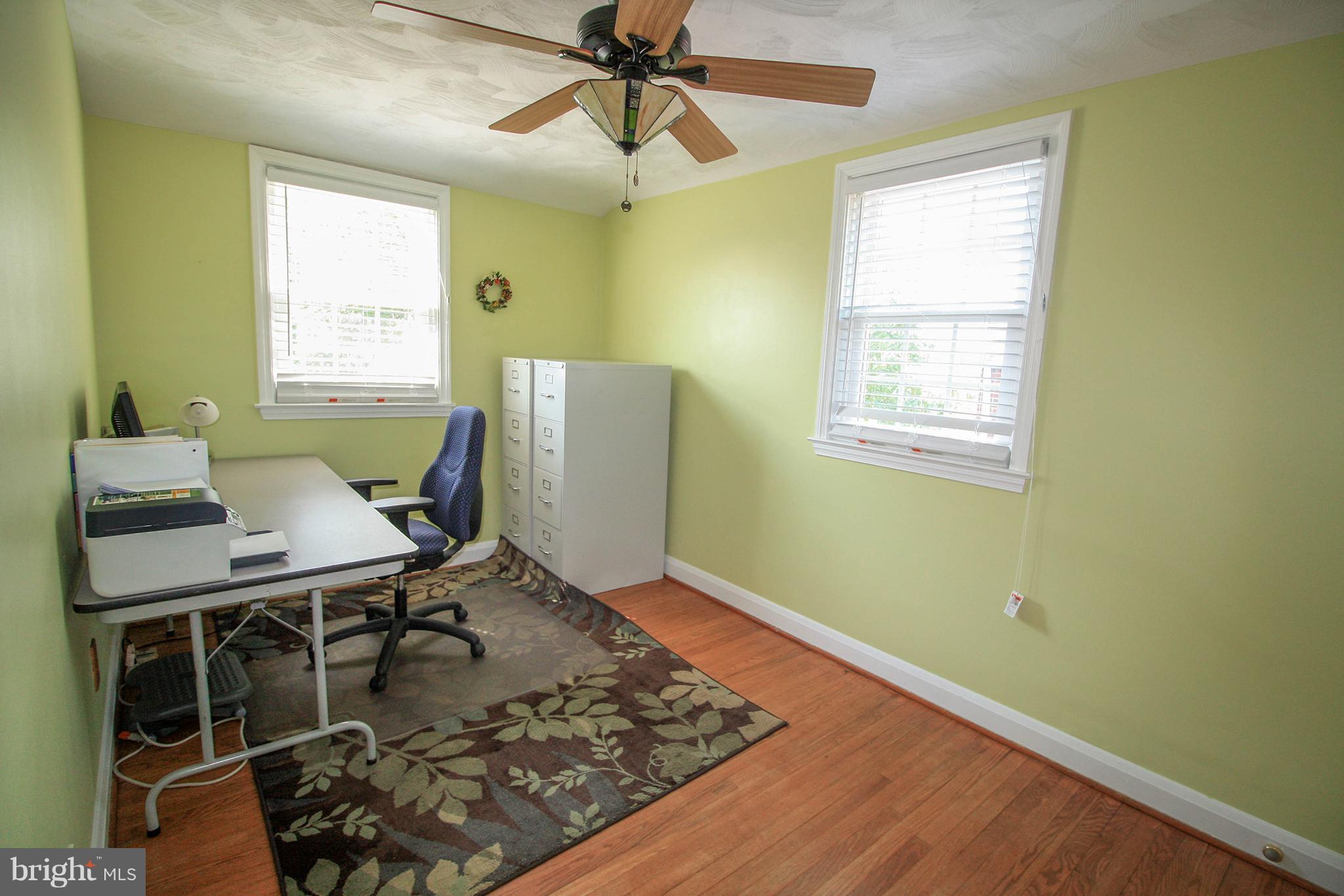 8427 Pleasant Plains Road Baltimore, MD 21286 - Photo 21 of 30 a workspace with furniture and window
