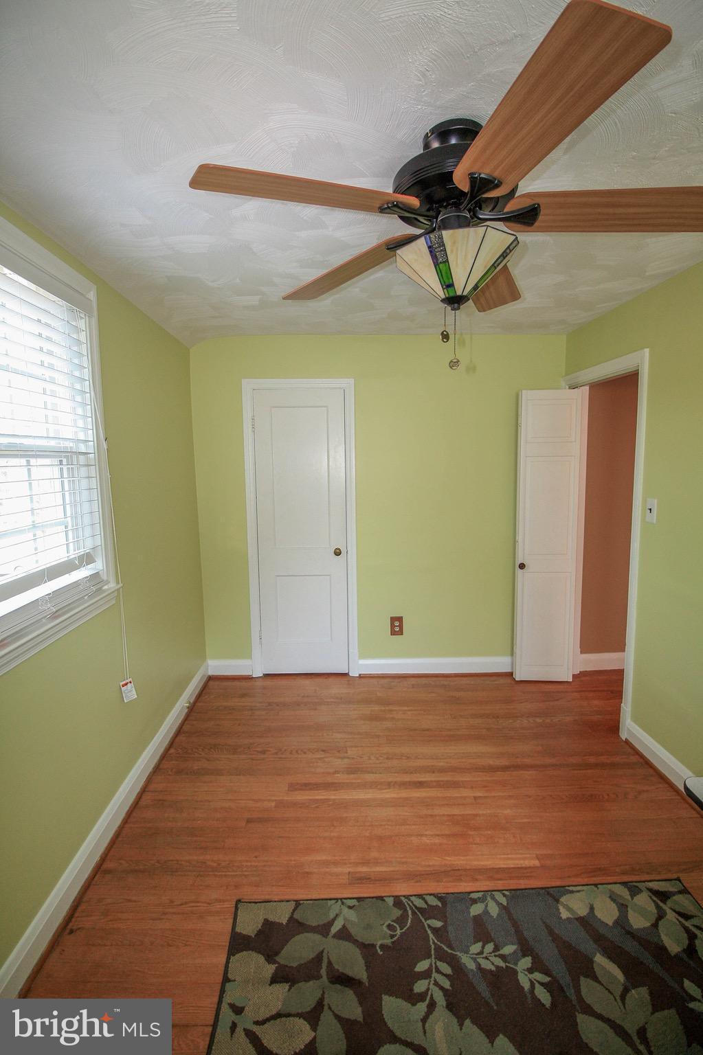8427 Pleasant Plains Road Baltimore, MD 21286 - Photo 22 of 30 a view of room with window and ceiling fan
