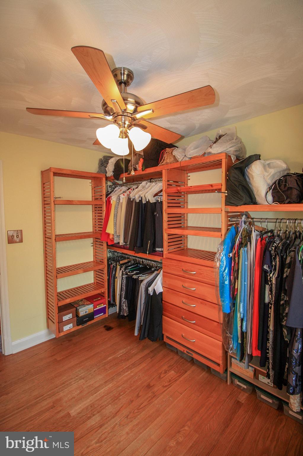 8427 Pleasant Plains Road Baltimore, MD 21286 - Photo 24 of 30 a view of walk in closet with clothes and shoes
