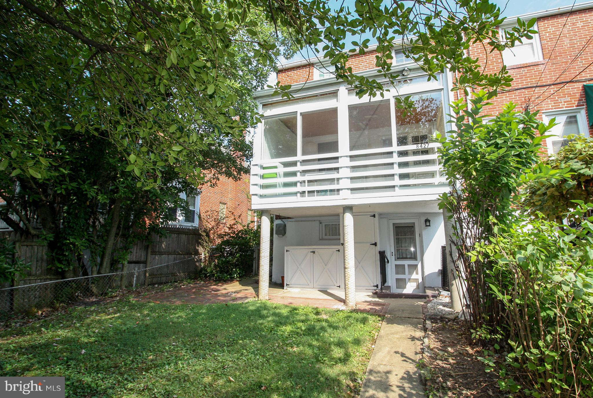 8427 Pleasant Plains Road Baltimore, MD 21286 - Photo 5 of 30 front view of a house with a yard