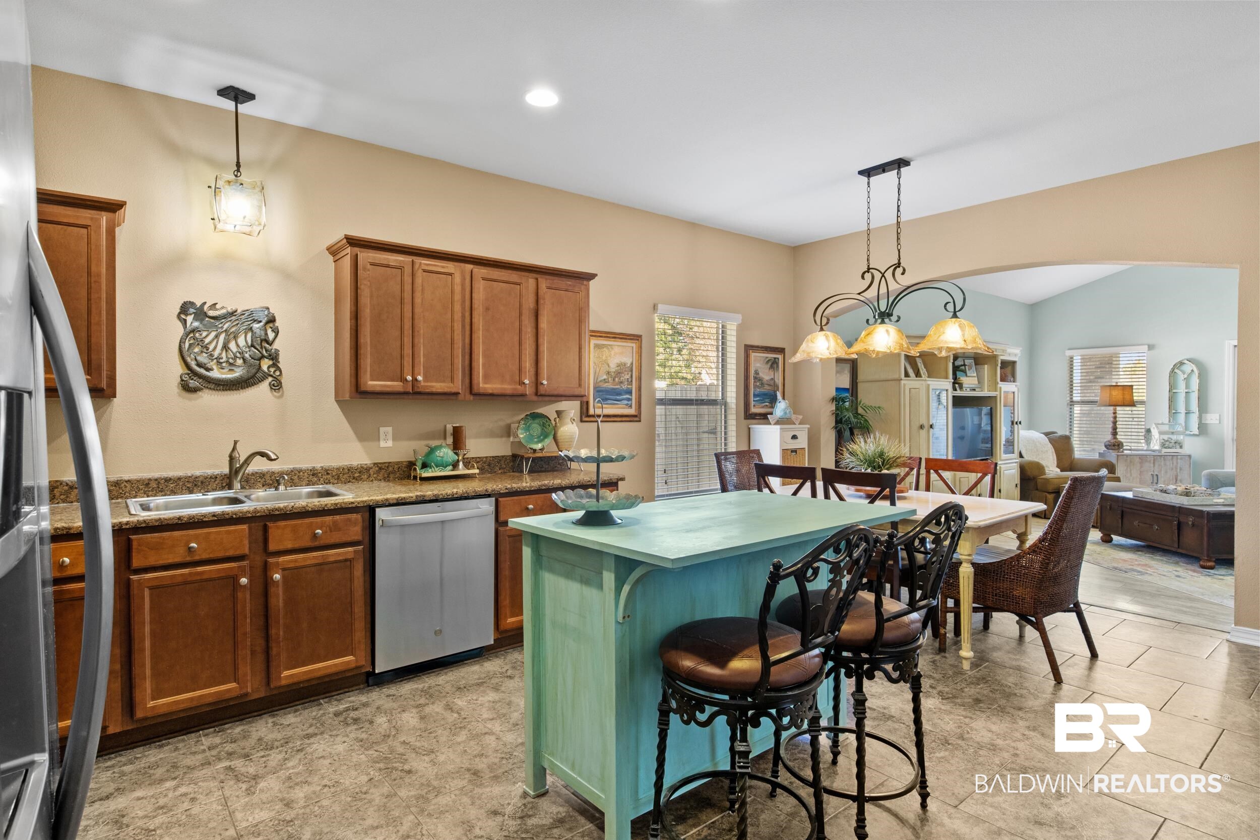 1752 Abbey Loop Foley, AL 36535 - Photo 8 of 21 Kitchen with a breakfast bar, dishwasher, sink, decorative light fixtures, and a kitchen island