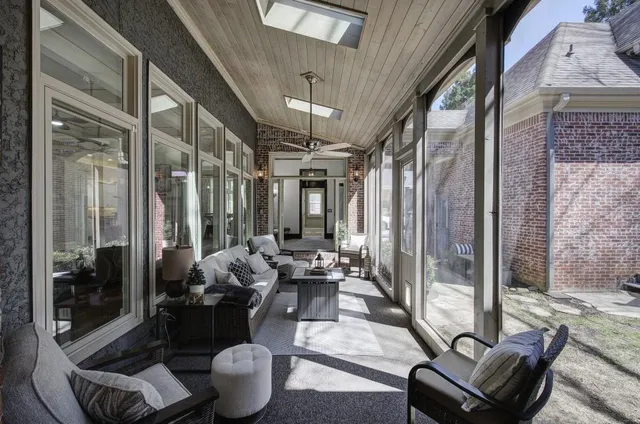 a bathroom with granite countertop a sink a washer and dryer
