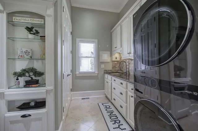 a bathroom with a granite countertop sink a mirror and shower