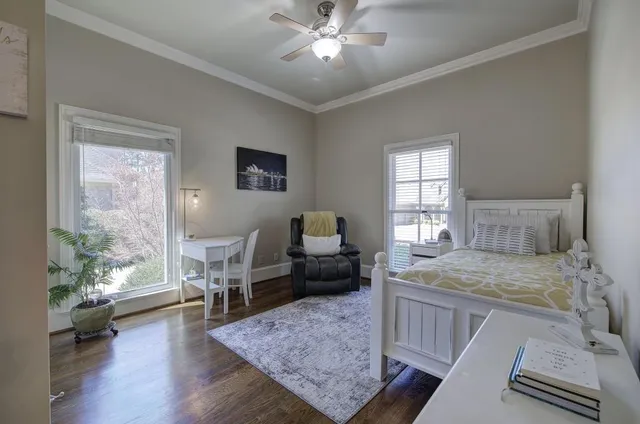 a view of a hallway view with wooden floor and staircase