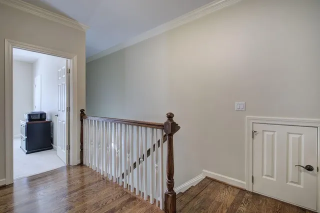 a spacious bathroom with a double vanity sink a large mirror and shower
