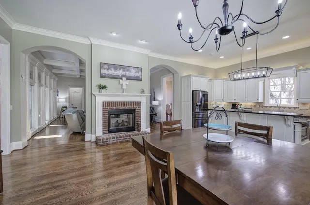 a kitchen with stainless steel appliances a sink stove and refrigerator