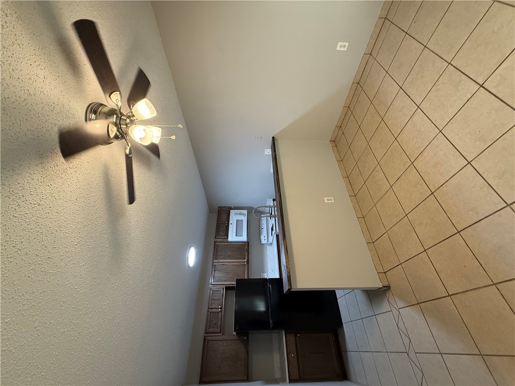 2000 Kazmeier, Unit 25 Bryan, TX 77802 - Photo 6 of 11 a view of kitchen with microwave and cabinets