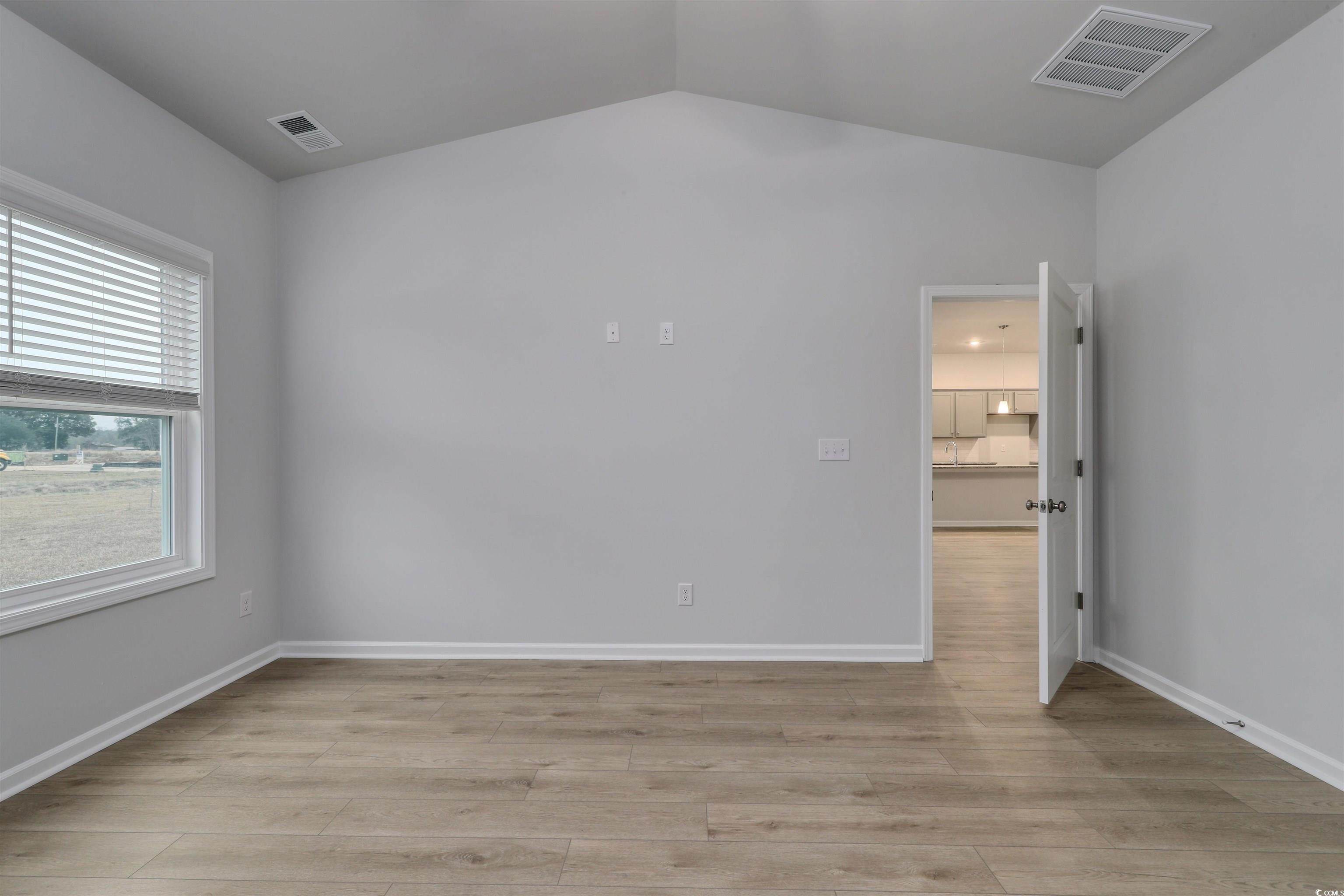 370 Garden Grove Street Conway, SC 29526 - Photo 15 of 28 Spare room featuring vaulted ceiling and light wood finished floors