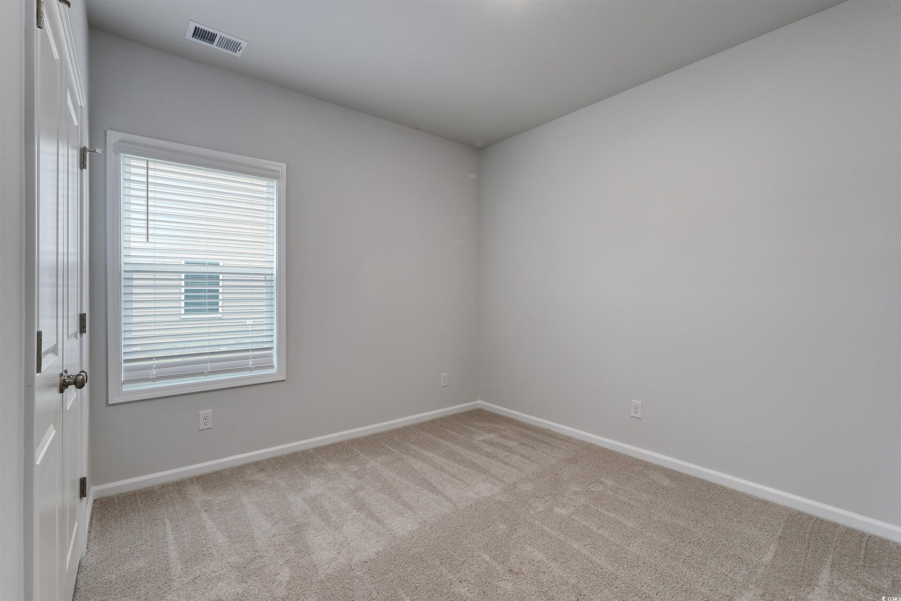 370 Garden Grove Street Conway, SC 29526 - Photo 23 of 28 Spare room with baseboards and light colored carpet