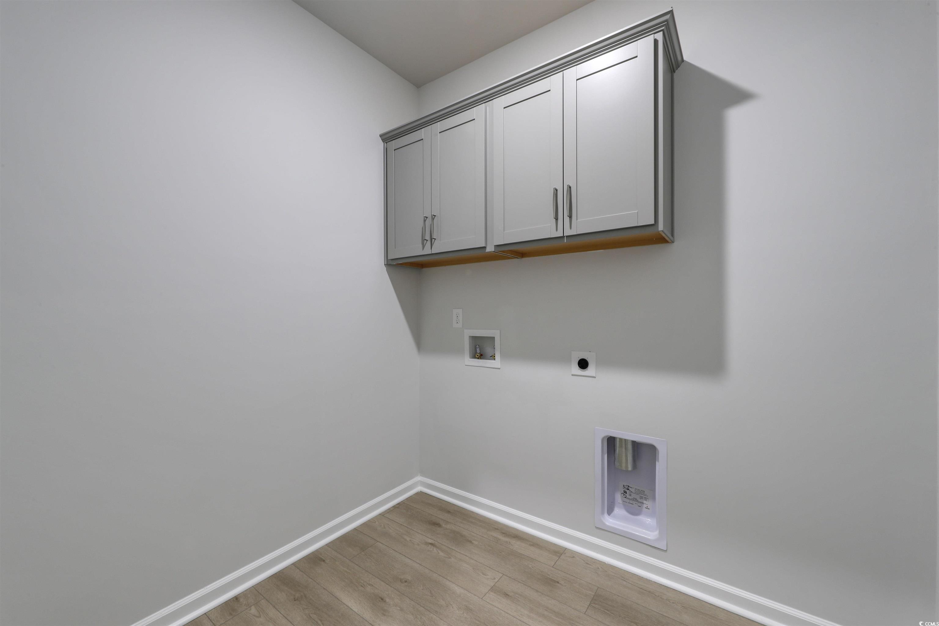 370 Garden Grove Street Conway, SC 29526 - Photo 26 of 28 Laundry room with cabinet space, washer hookup, light wood-style flooring, and hookup for an electric dryer