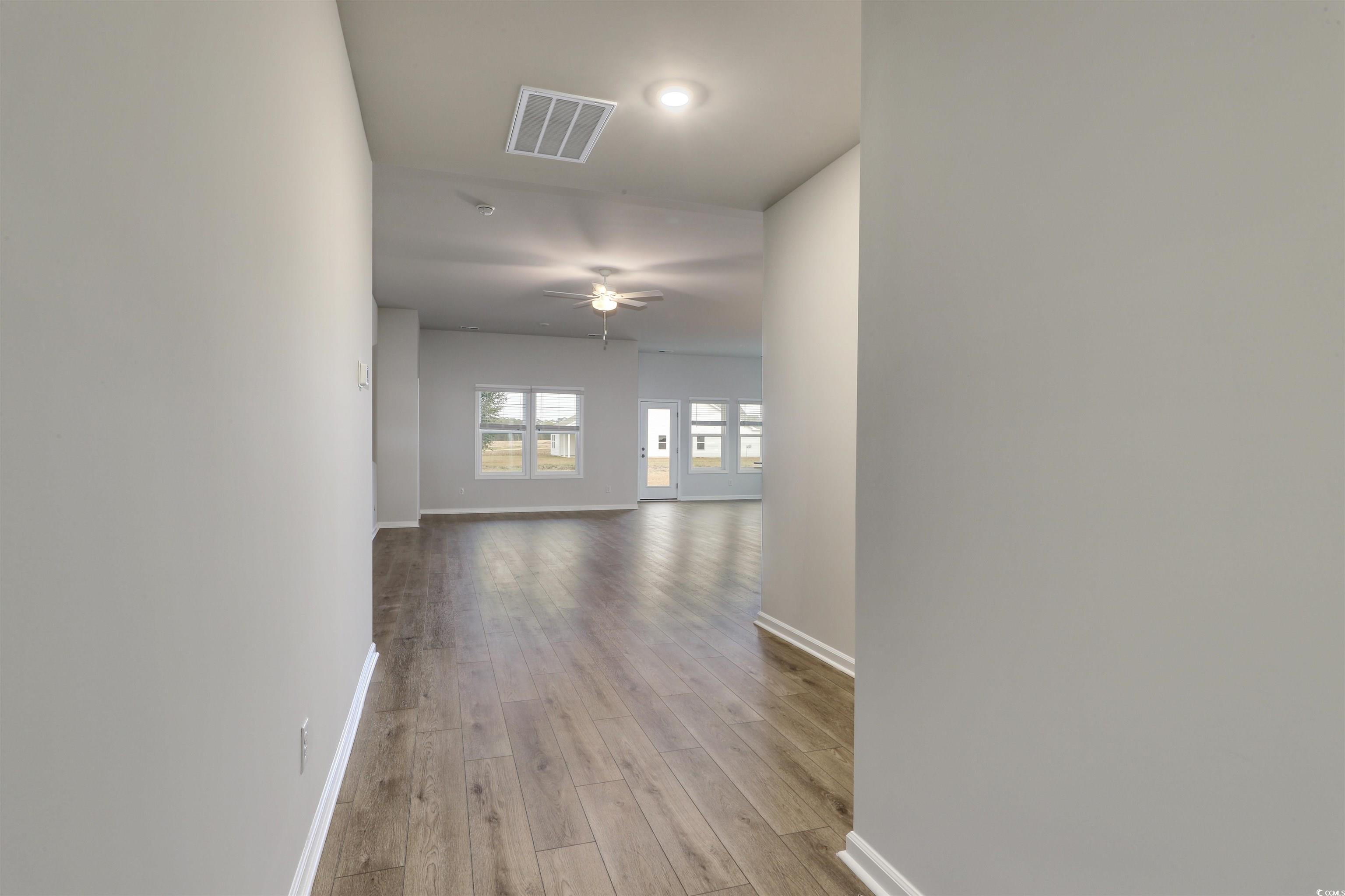 370 Garden Grove Street Conway, SC 29526 - Photo 3 of 28 Corridor with baseboards and light wood finished floors