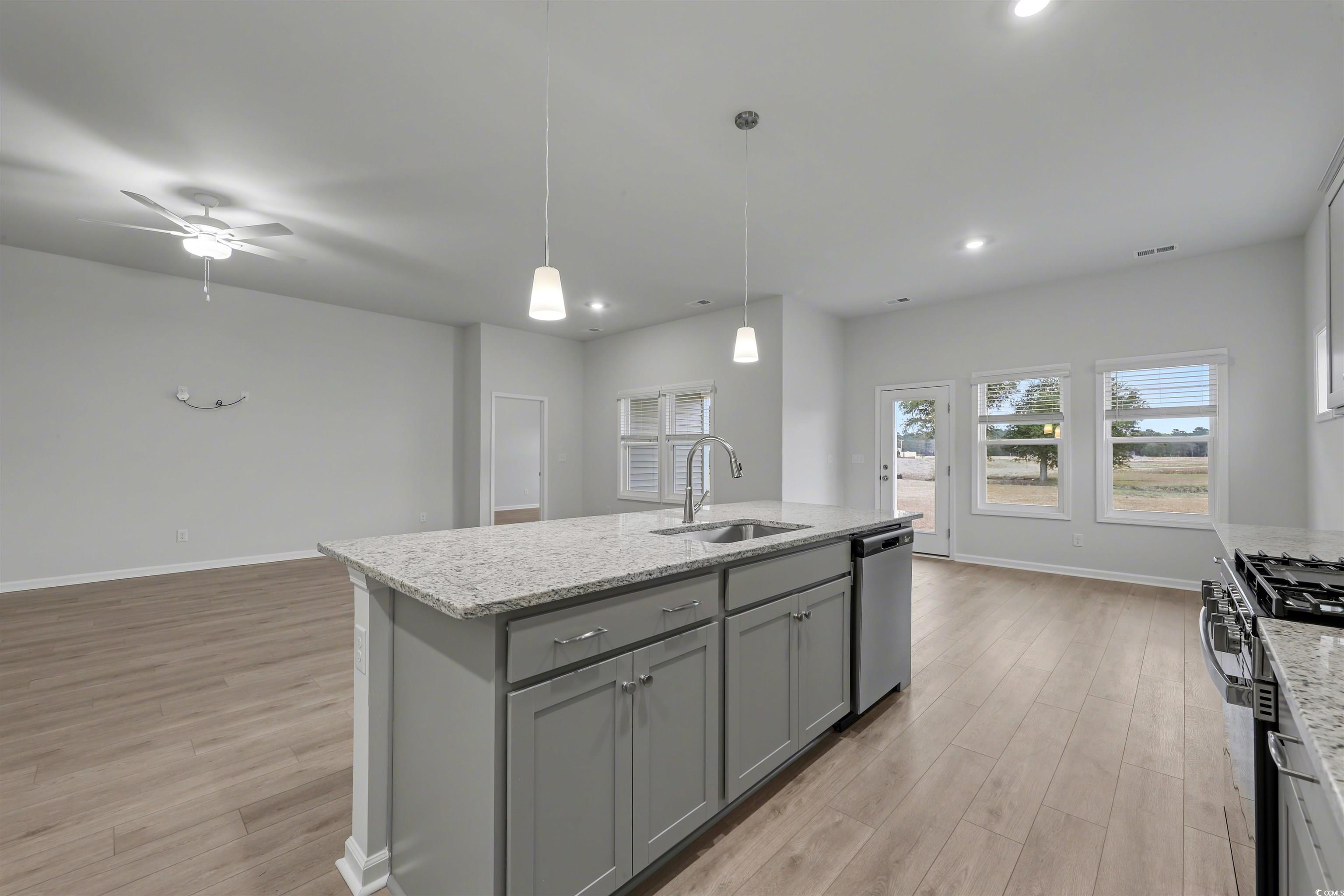 370 Garden Grove Street Conway, SC 29526 - Photo 8 of 28 Kitchen with gray cabinetry, light stone counters, hanging light fixtures, recessed lighting, and an island with sink