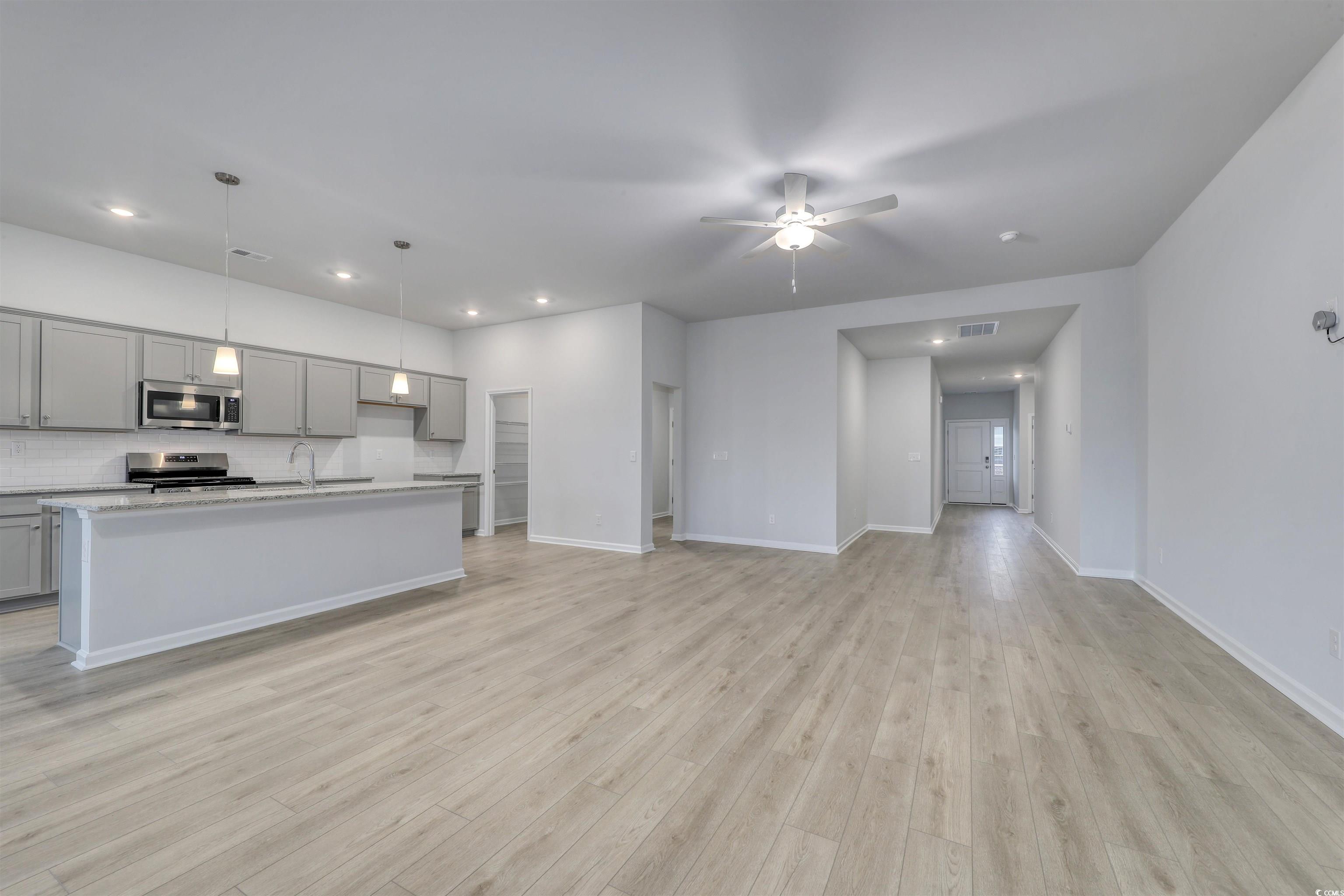 370 Garden Grove Street Conway, SC 29526 - Photo 10 of 28 Unfurnished living room featuring ceiling fan, light wood finished floors, and recessed lighting
