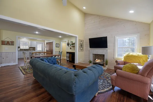 a living room with furniture and a fireplace