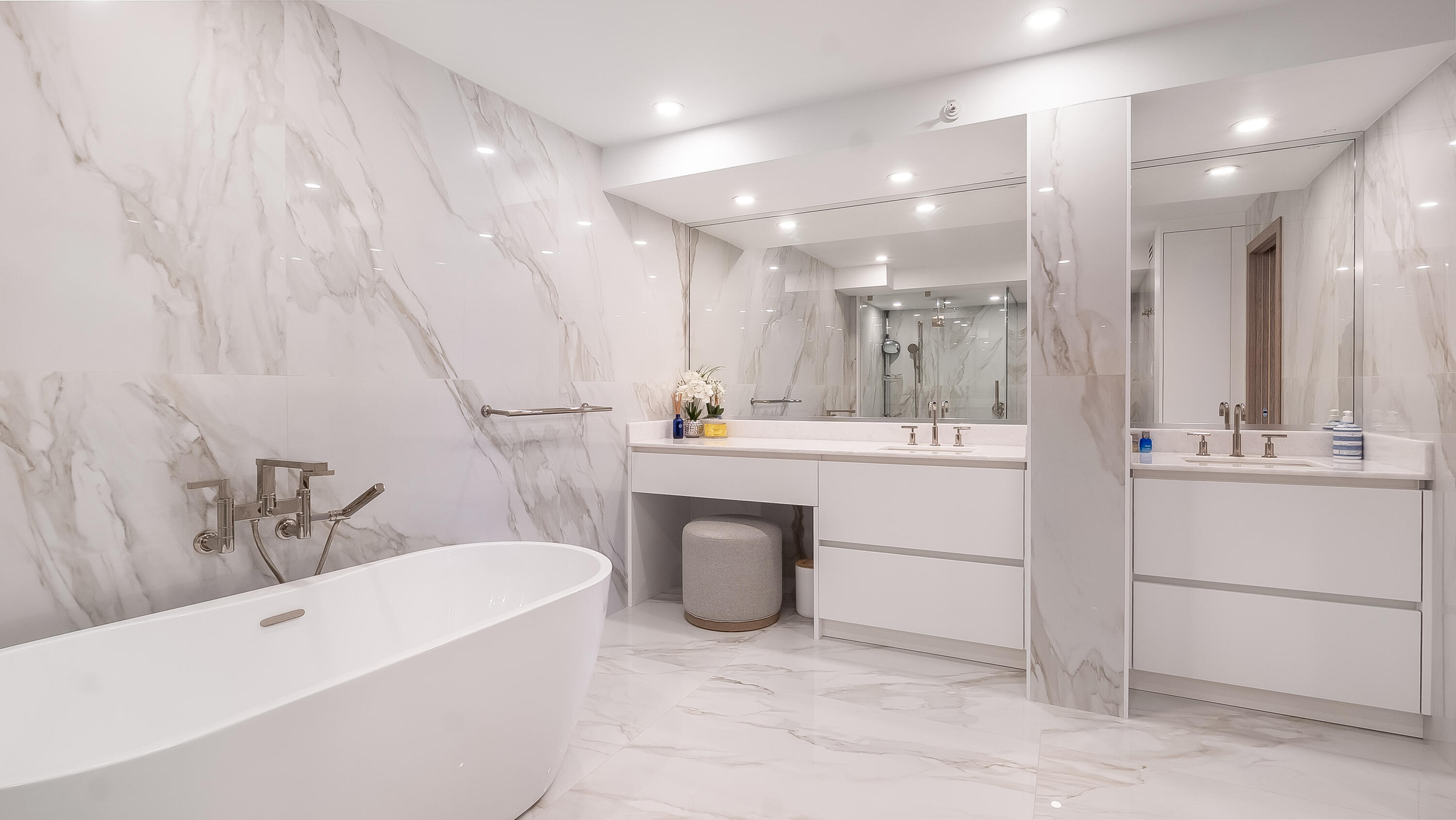 901 East Camino Real, Unit 2A Boca Raton, FL 33432 - Photo 26 of 30 a bathroom with a bathtub sink a mirror and a shower