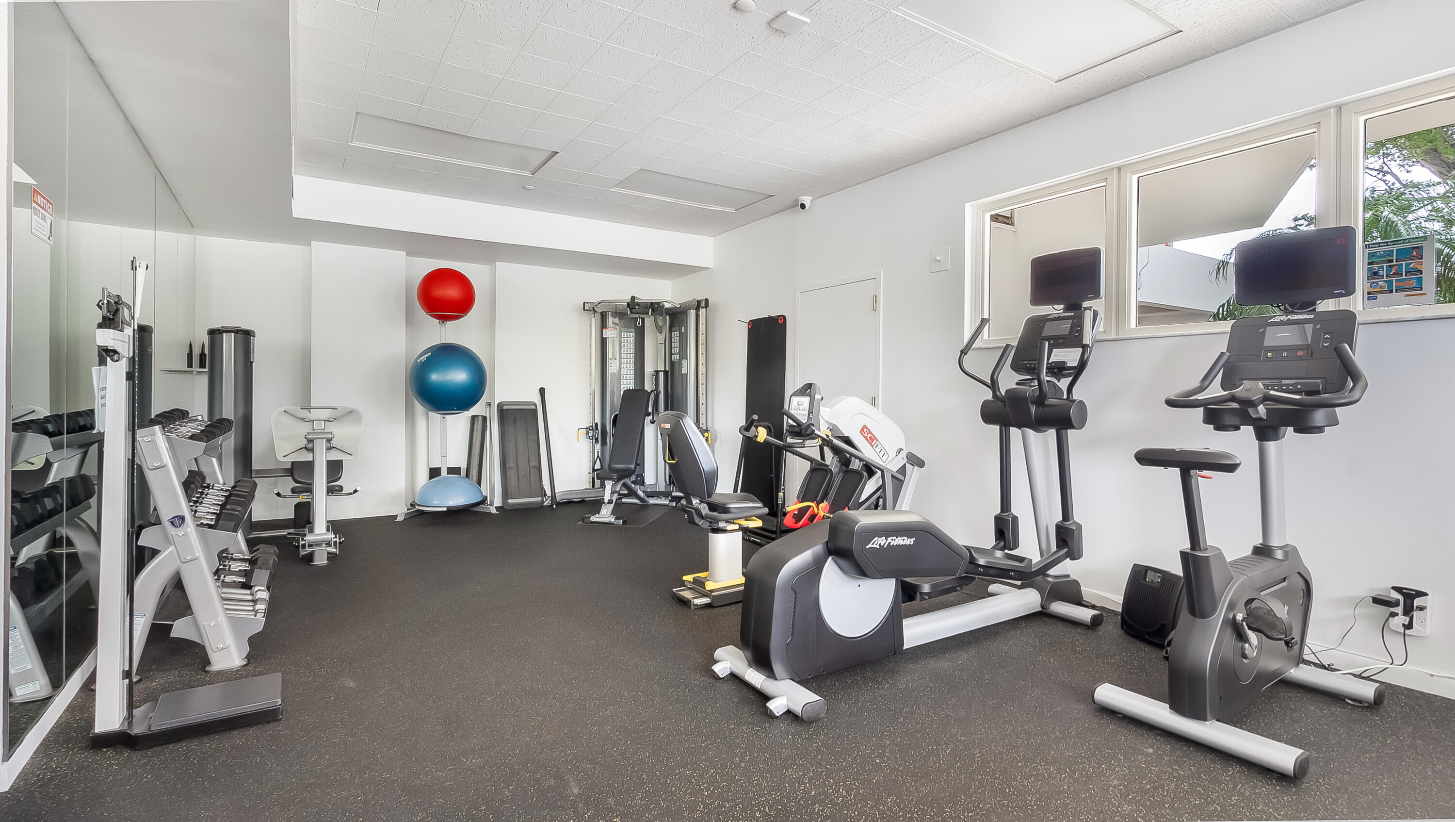 901 East Camino Real, Unit 2A Boca Raton, FL 33432 - Photo 29 of 30 a view of a room with gym equipment