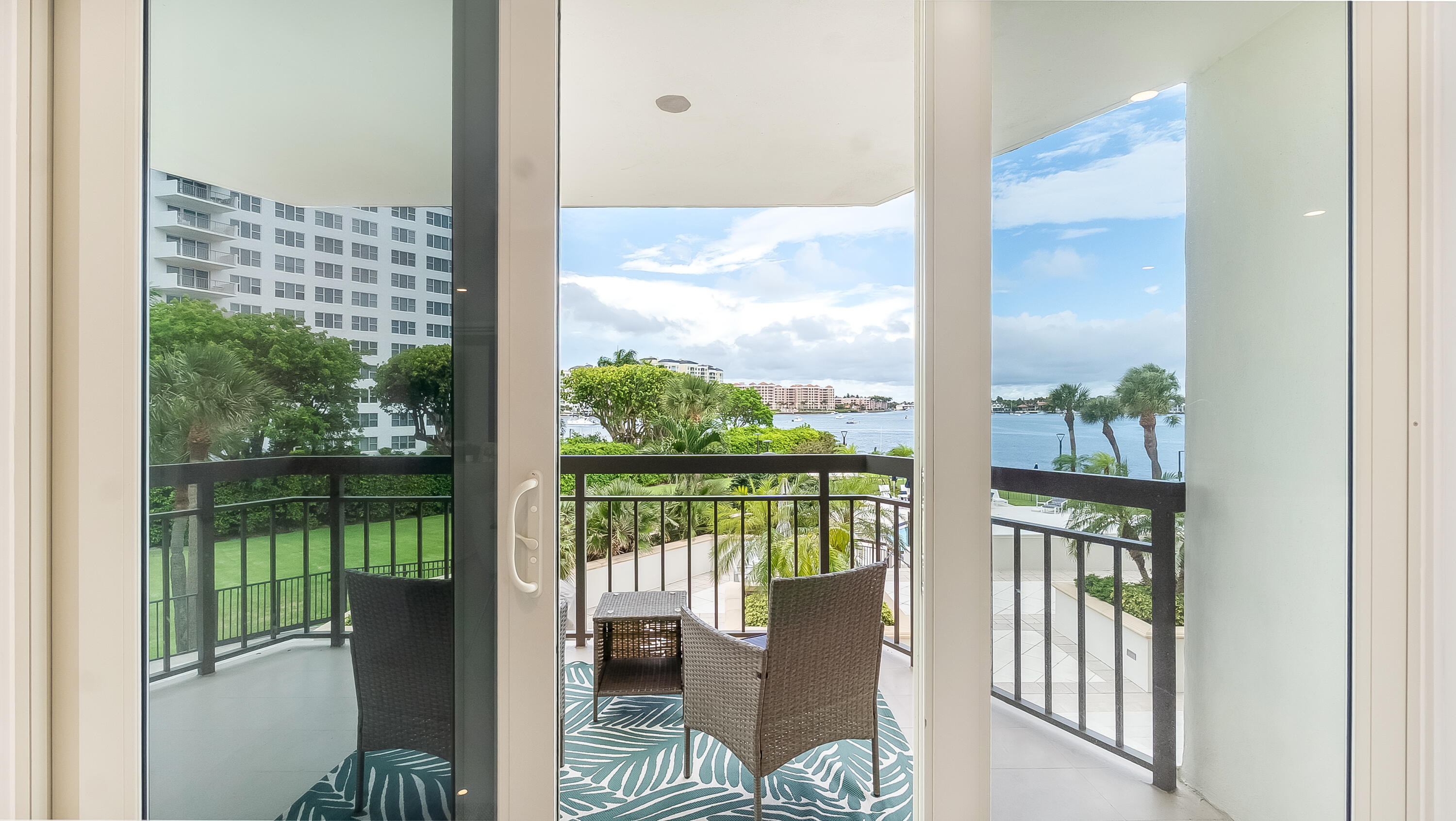 901 East Camino Real, Unit 2A Boca Raton, FL 33432 - Photo 6 of 30 a view of a balcony with chair and table