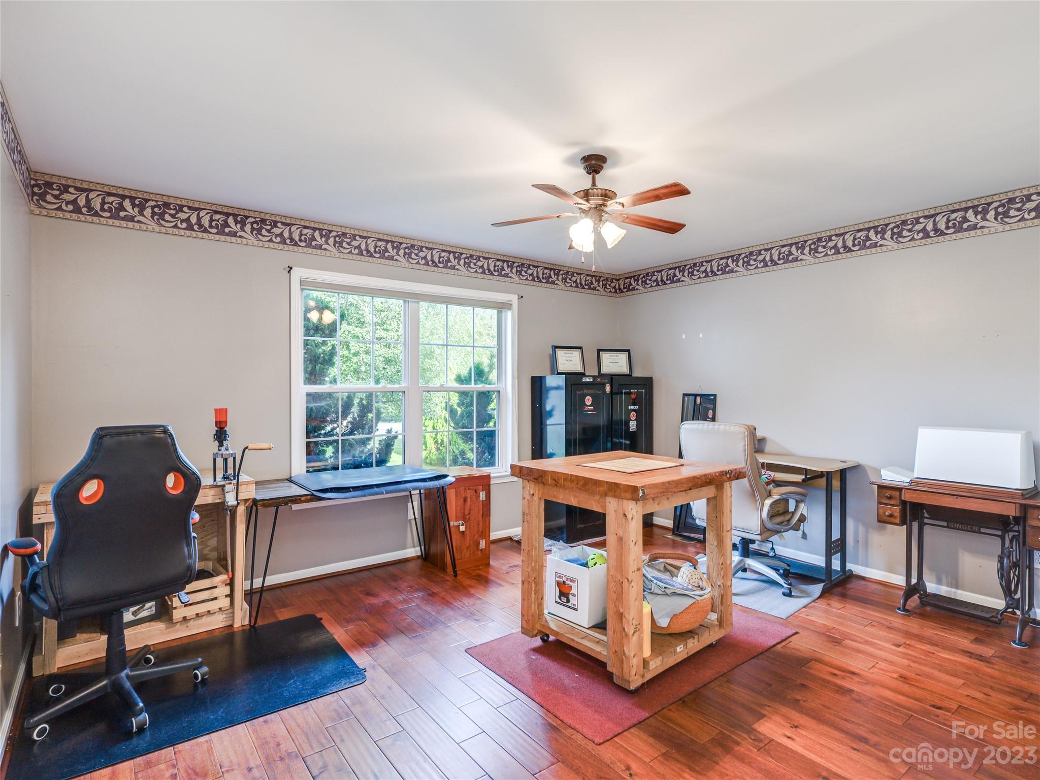 111 Hoyle Street Morganton, NC 28655 - Photo 11 of 30 a living room with furniture a rug potted plant and a window