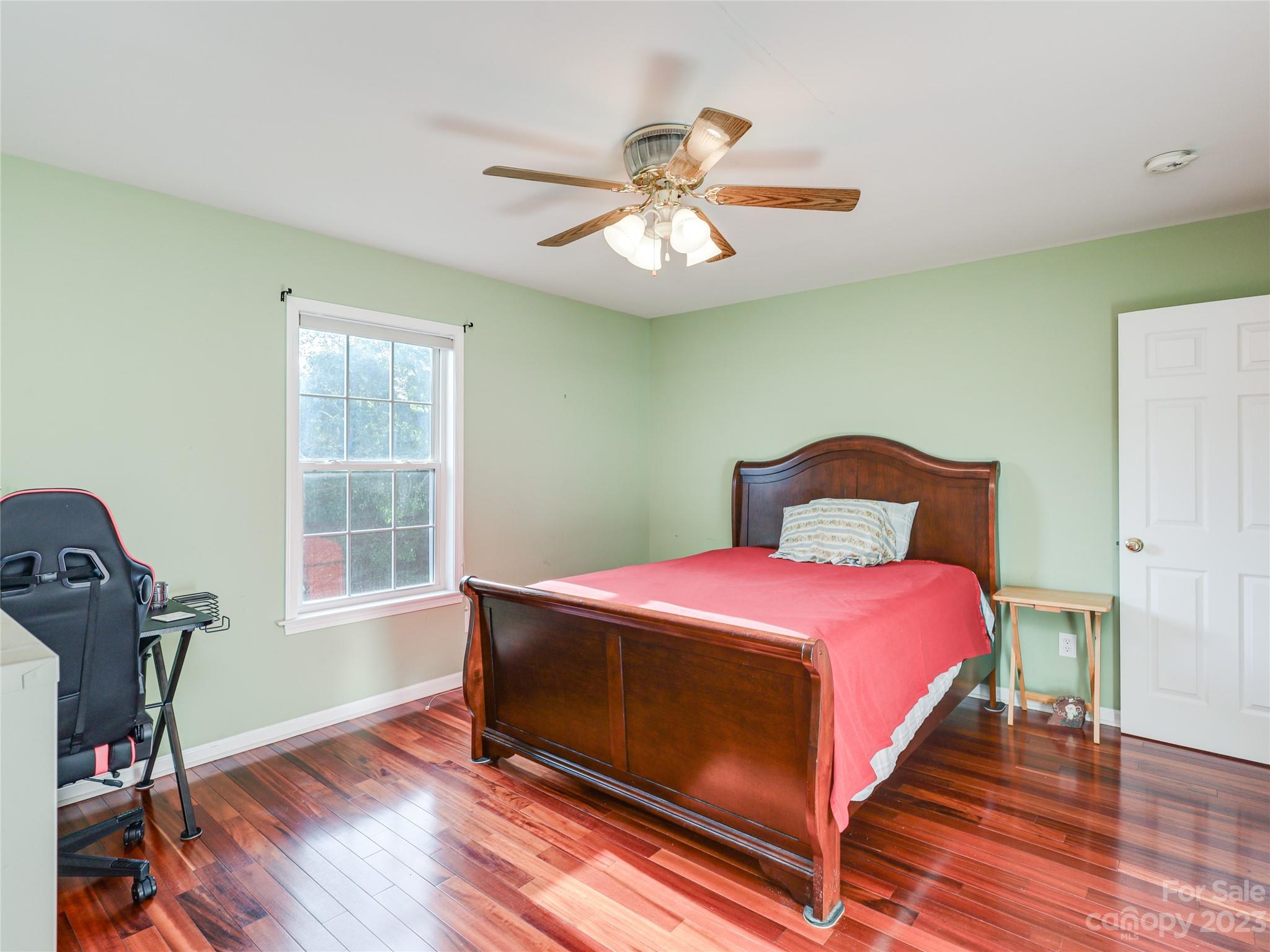 111 Hoyle Street Morganton, NC 28655 - Photo 16 of 30 a bedroom with a bed and wooden floor
