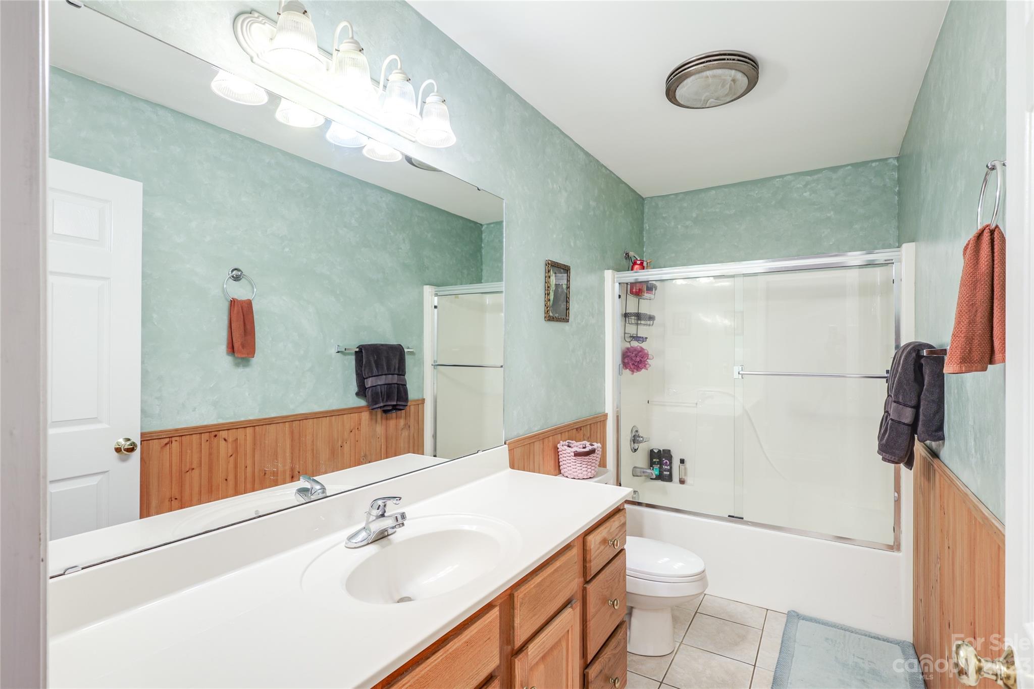 111 Hoyle Street Morganton, NC 28655 - Photo 8 of 30 a bathroom with a sink a toilet and a mirror