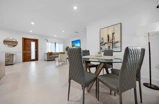 a view of a dining room with furniture and a livingroom