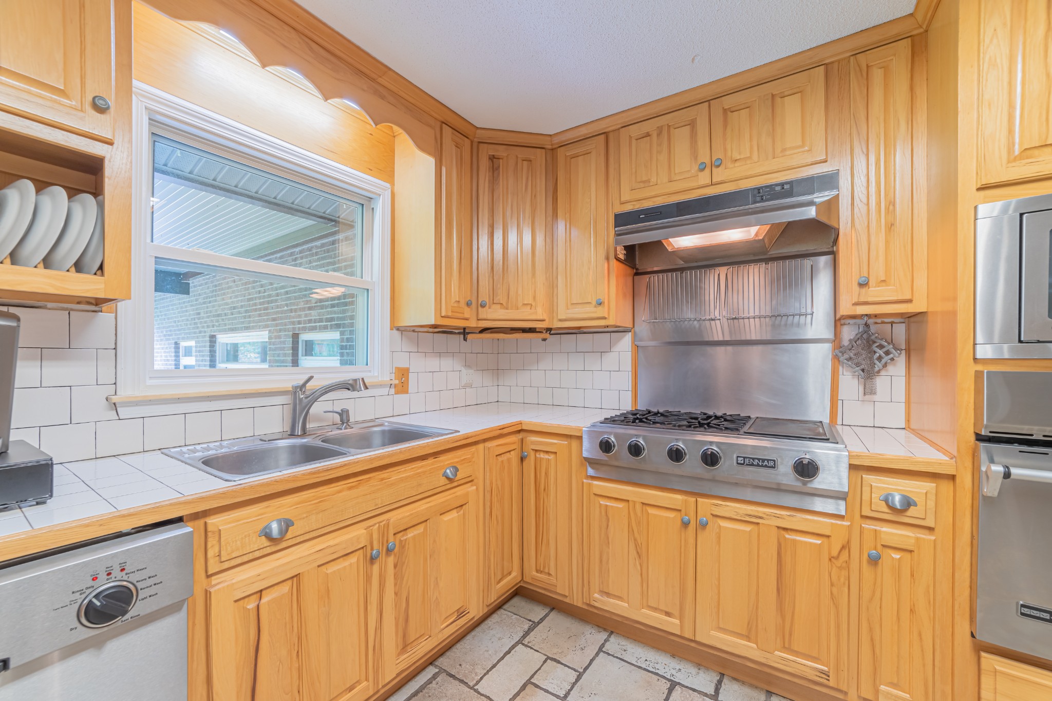 292 Laynes Cove Road Pelham, TN 37366 - Photo 15 of 43 a kitchen with stainless steel appliances granite countertop a sink and cabinets