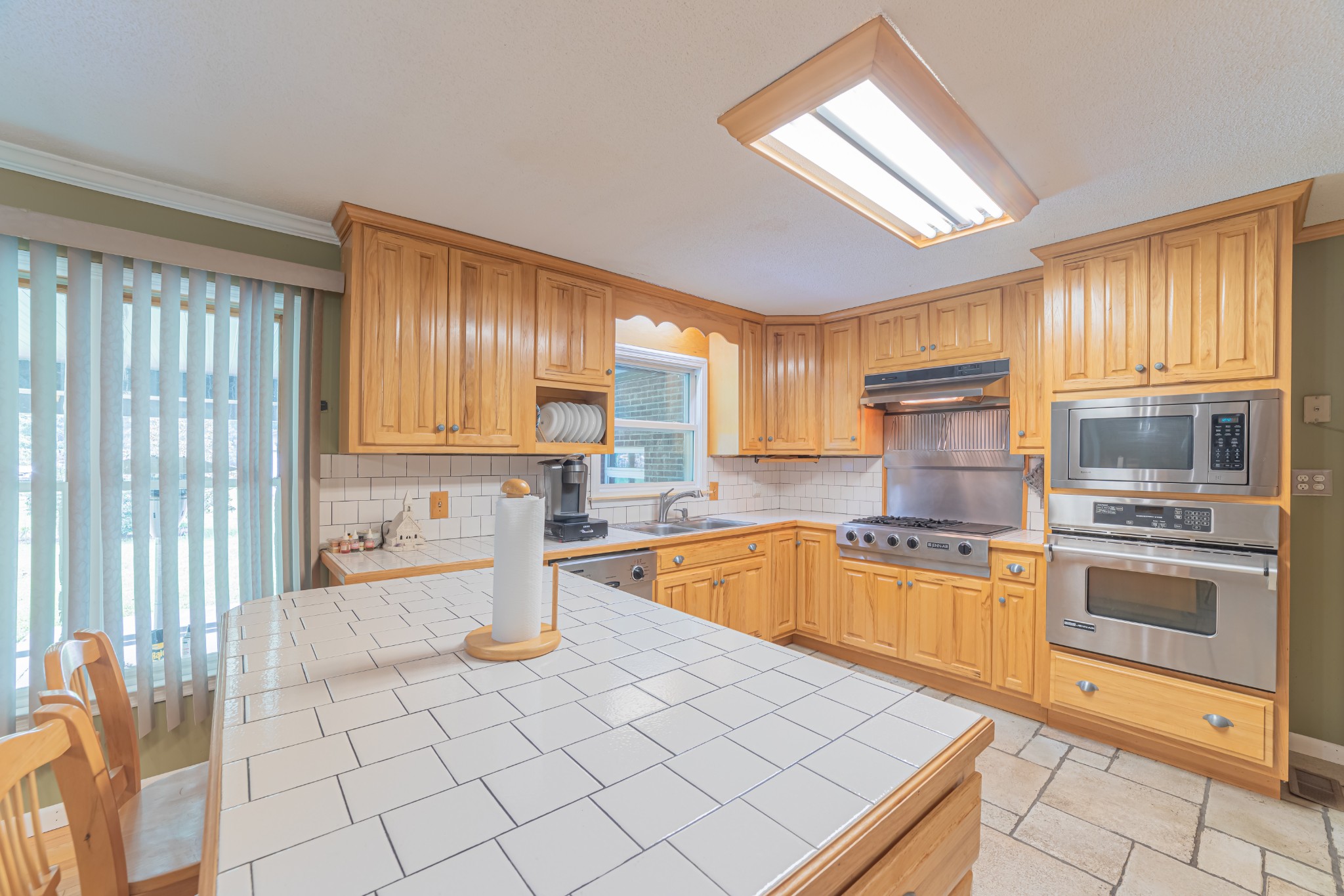 292 Laynes Cove Road Pelham, TN 37366 - Photo 16 of 43 a kitchen with a sink a stove and cabinets