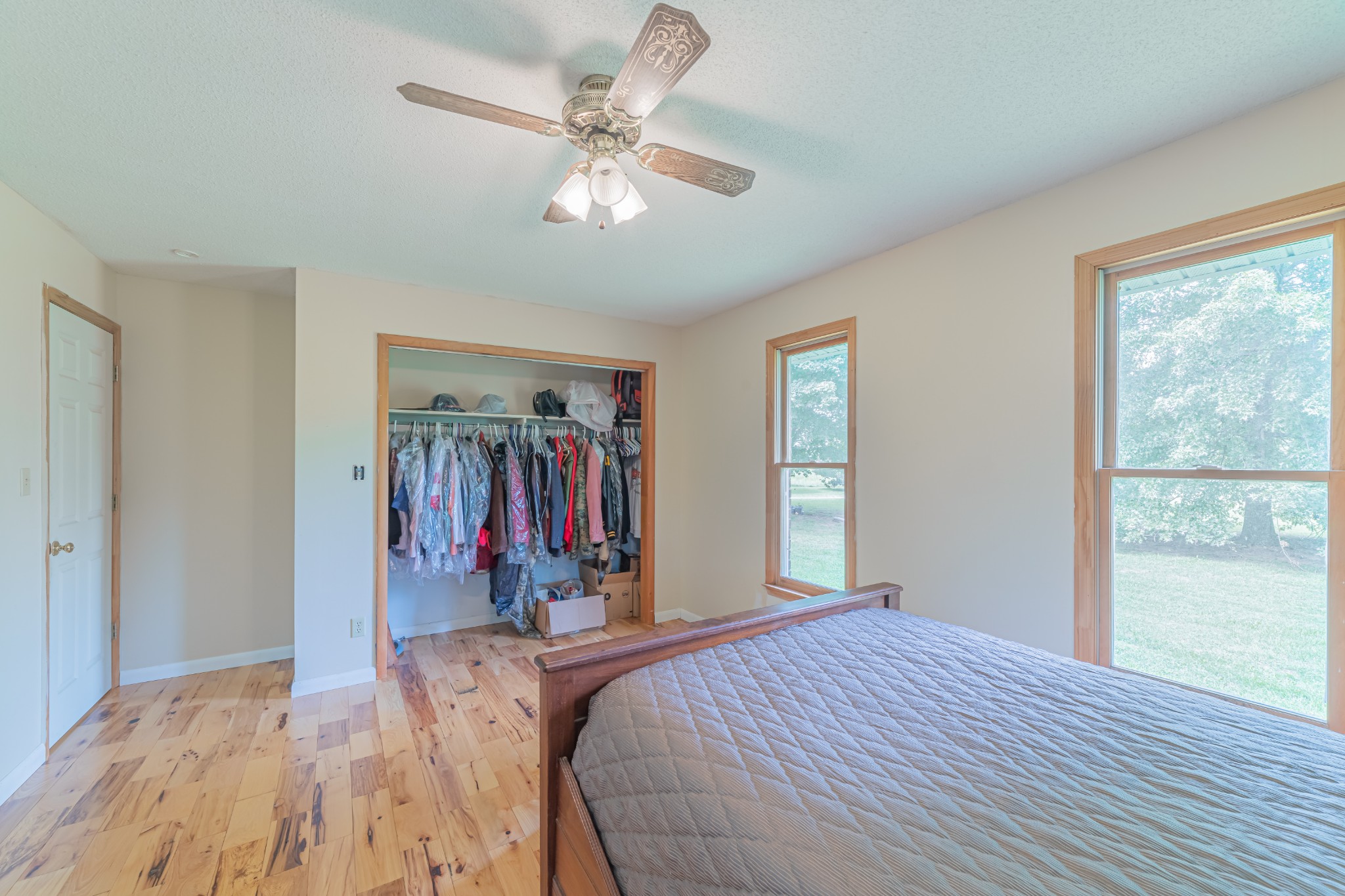 292 Laynes Cove Road Pelham, TN 37366 - Photo 21 of 43 a bed room with a bed and a chandelier