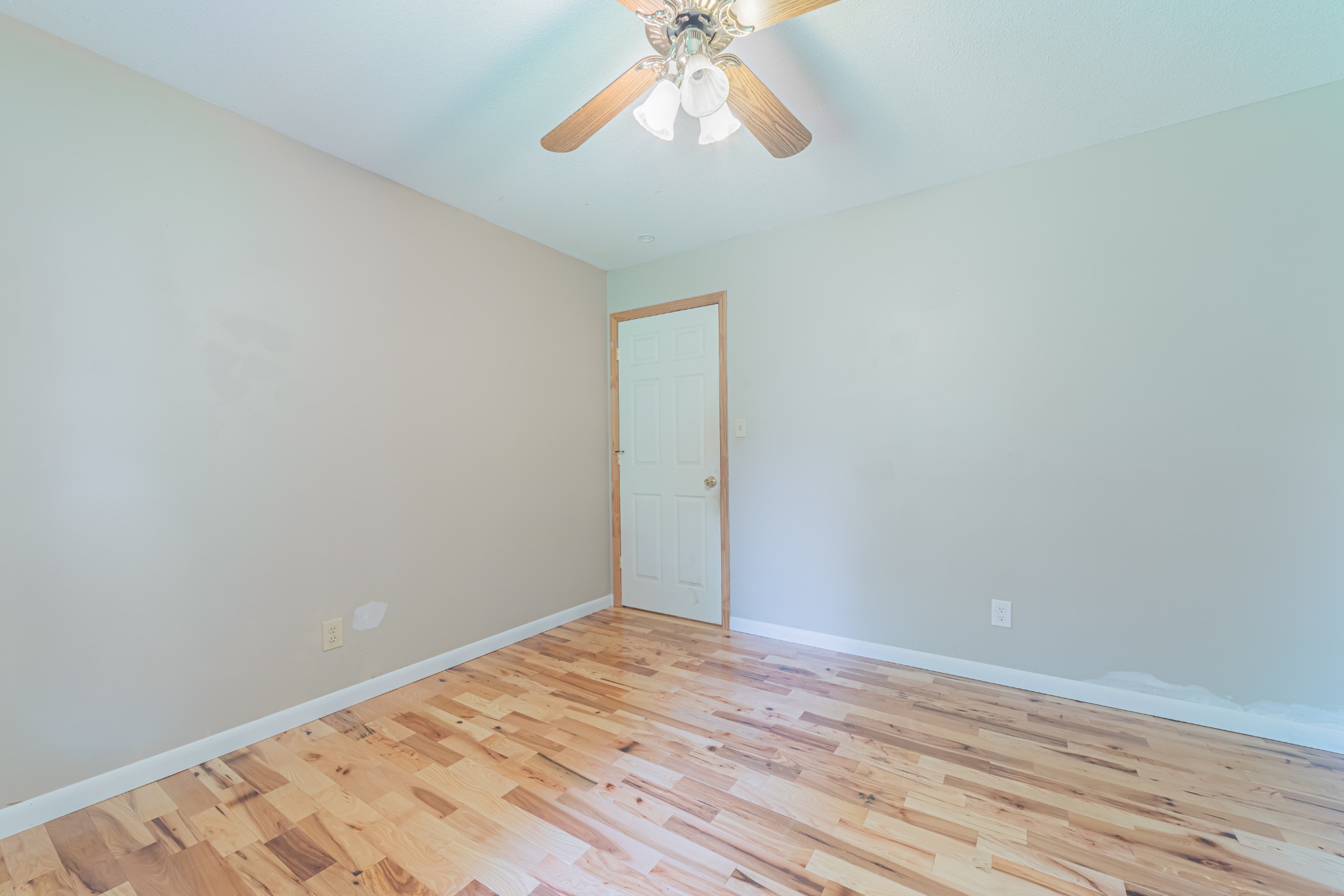 292 Laynes Cove Road Pelham, TN 37366 - Photo 24 of 43 a view of a room with wooden floor and a ceiling fan