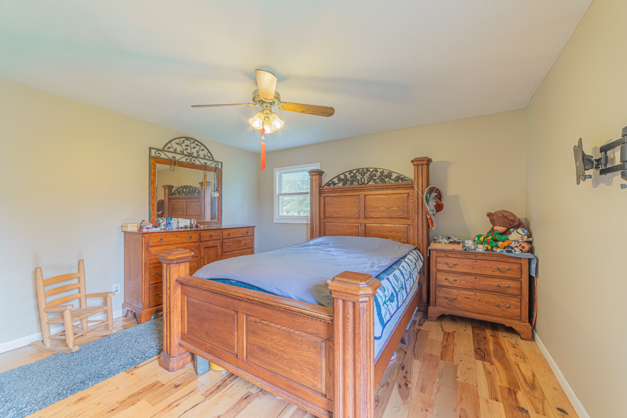 292 Laynes Cove Road Pelham, TN 37366 - Photo 29 of 43 a bedroom with a bed and a chandelier
