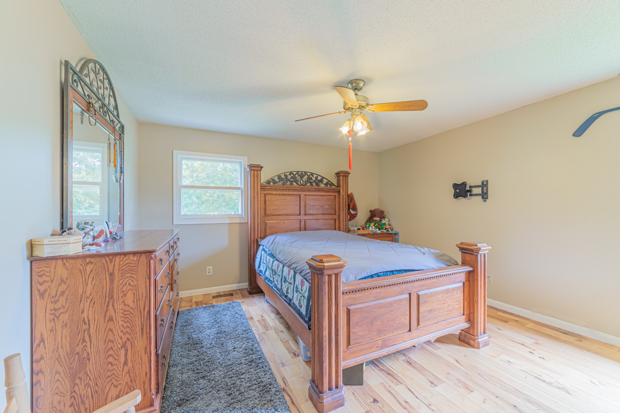 292 Laynes Cove Road Pelham, TN 37366 - Photo 30 of 43 a bedroom with a bed and a chandelier