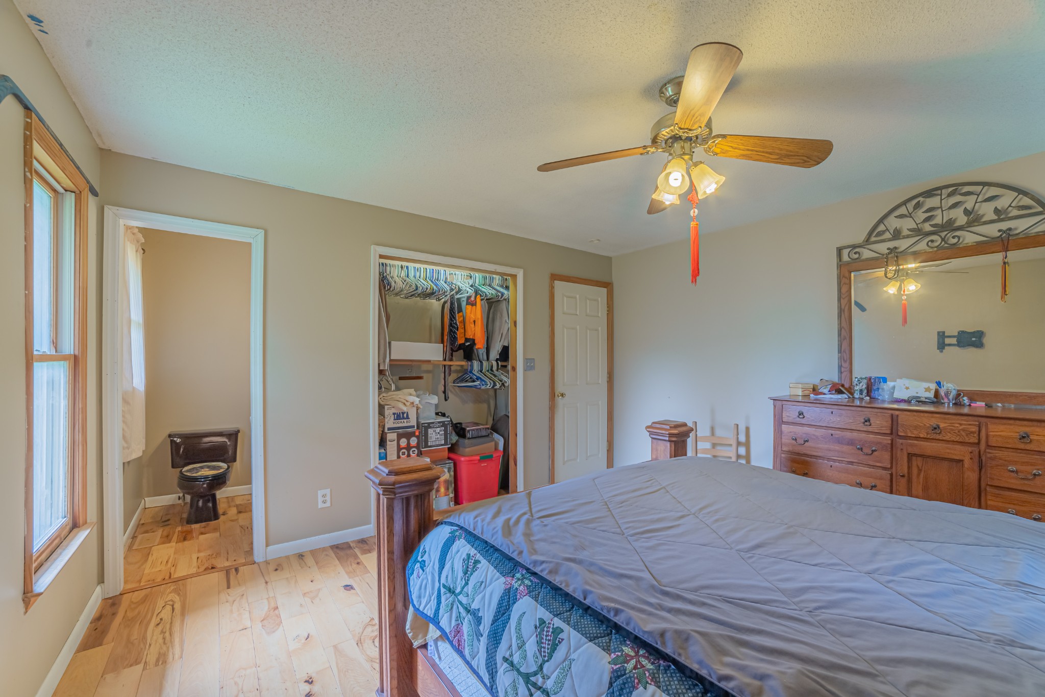 292 Laynes Cove Road Pelham, TN 37366 - Photo 31 of 43 a bed room with a bed and a chandelier