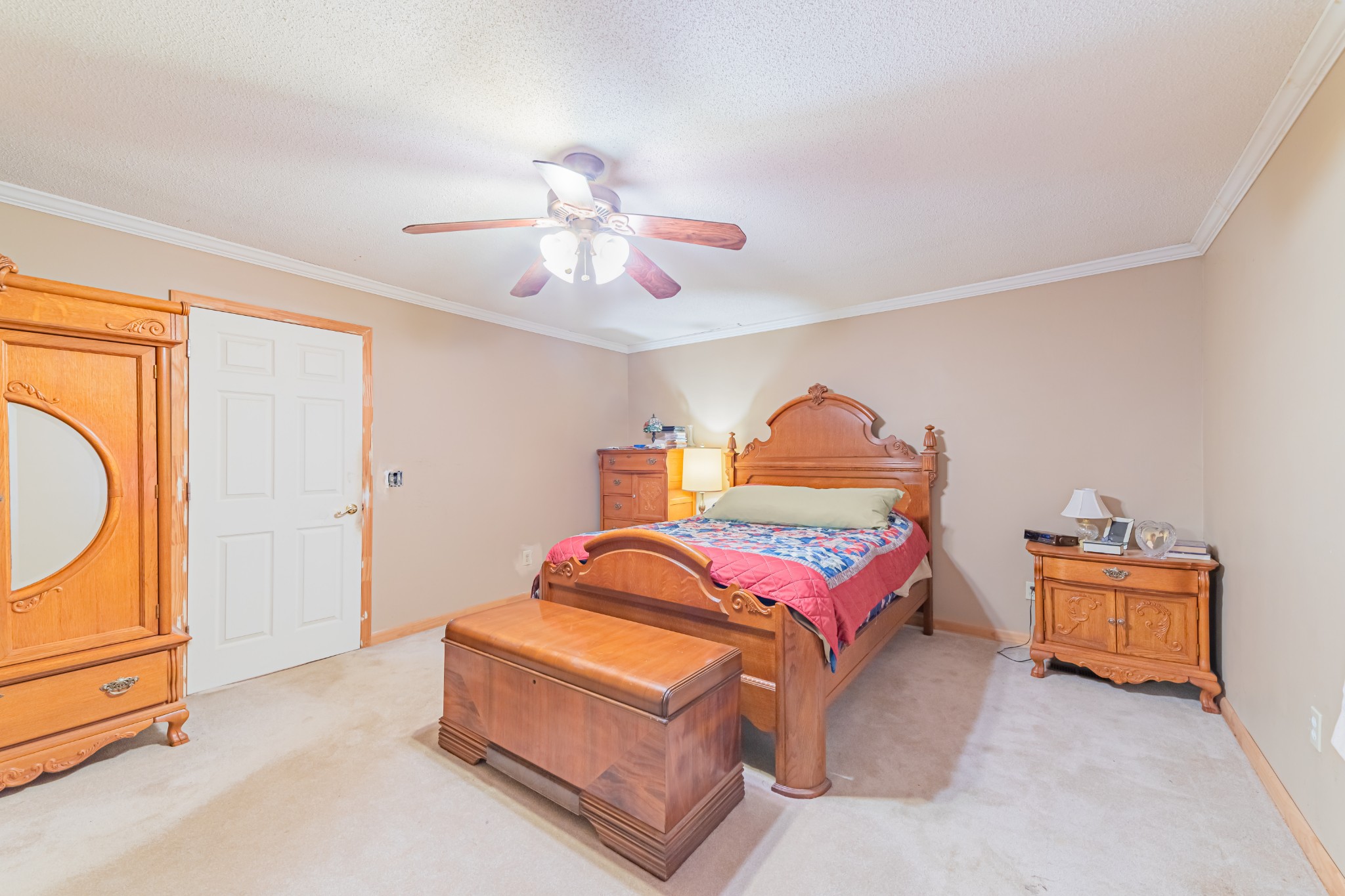 292 Laynes Cove Road Pelham, TN 37366 - Photo 34 of 43 a bedroom with a bed and a chandelier