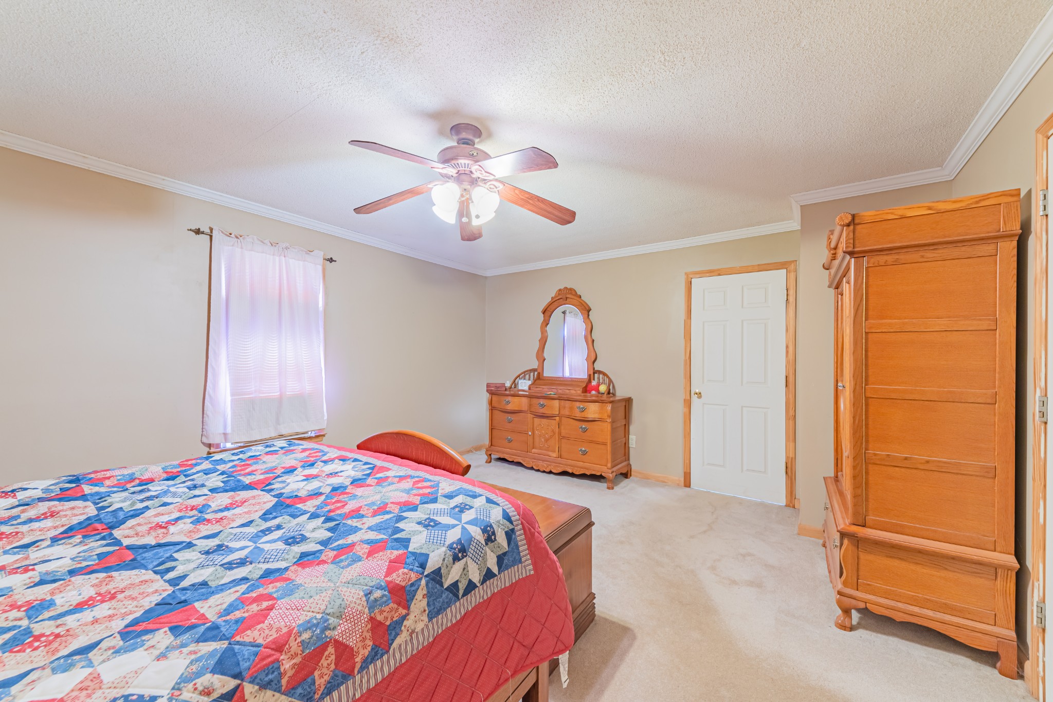 292 Laynes Cove Road Pelham, TN 37366 - Photo 35 of 43 a bedroom with a bed and a chandelier