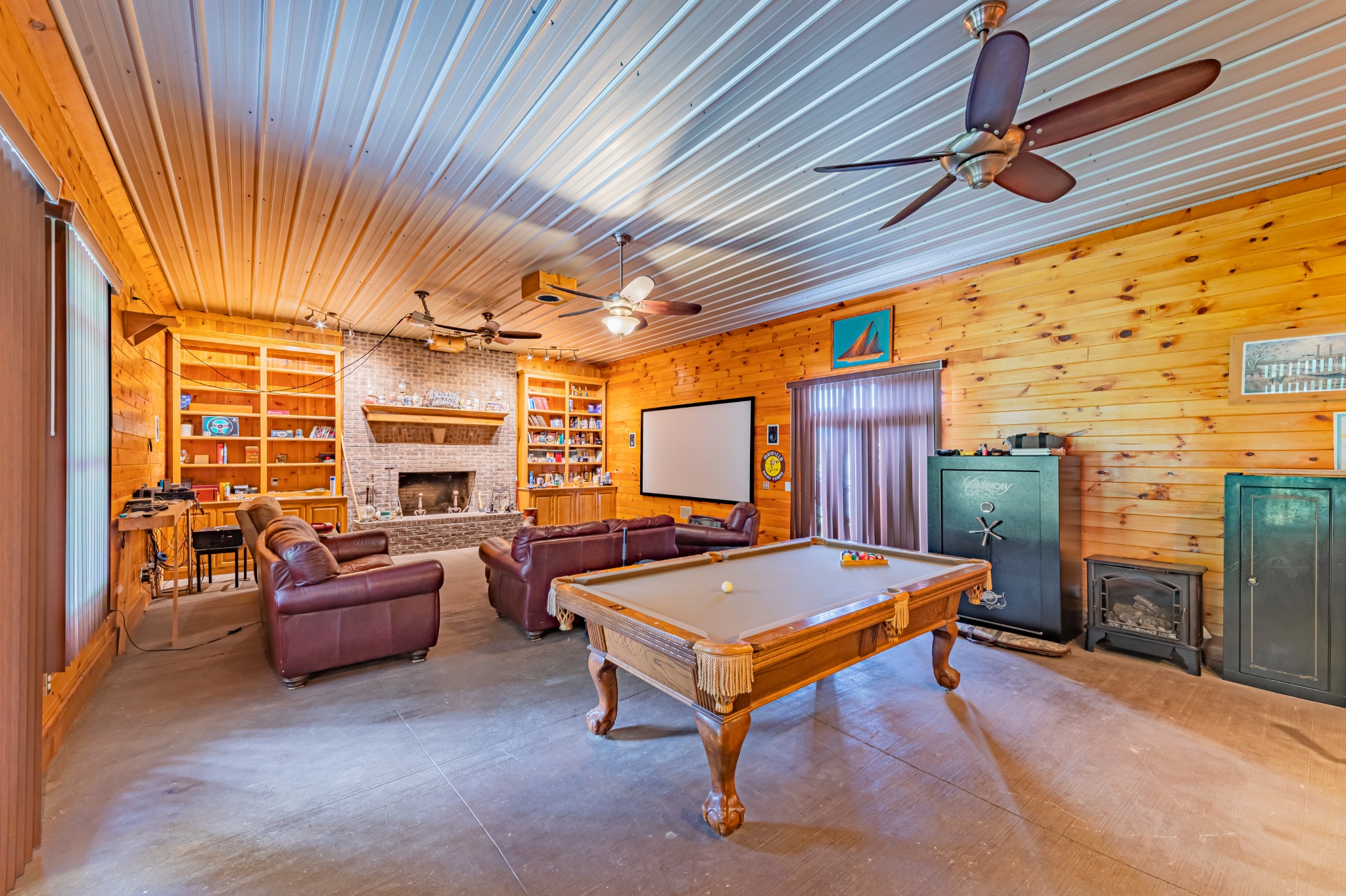 292 Laynes Cove Road Pelham, TN 37366 - Photo 36 of 43 a living room with furniture pool table wooden floor and windows