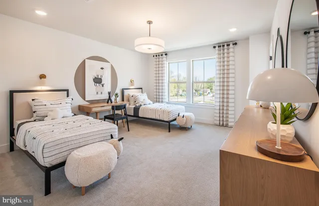 a bed room with a bed and a chandelier